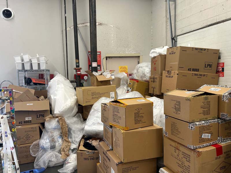 Picture of a commercial property with boxes of junk before removed