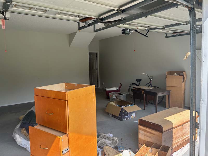 Picture of a garage full of junk about to be removed