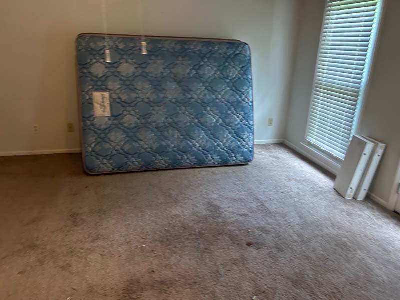 Picture of an old Mattress being hauled away